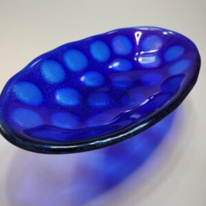 fused glass bowl, blue iridescent.